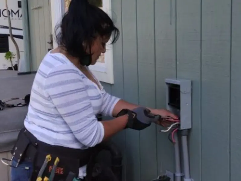 Licensed electrician wiring an exterior subpanel in Thompson's Station