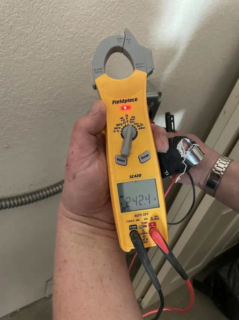 Voltage testing with clamp meter during Ceiling Fan Installation in Thompson's Station